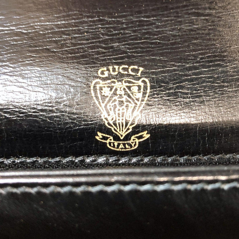 Vintage Gucci black leather shoulder bag with golden and silver