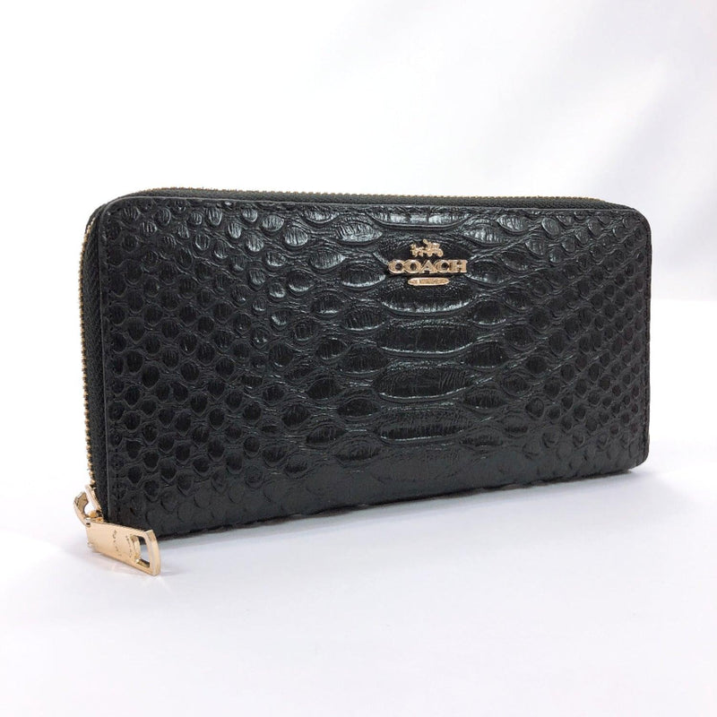 Used black and gold purse