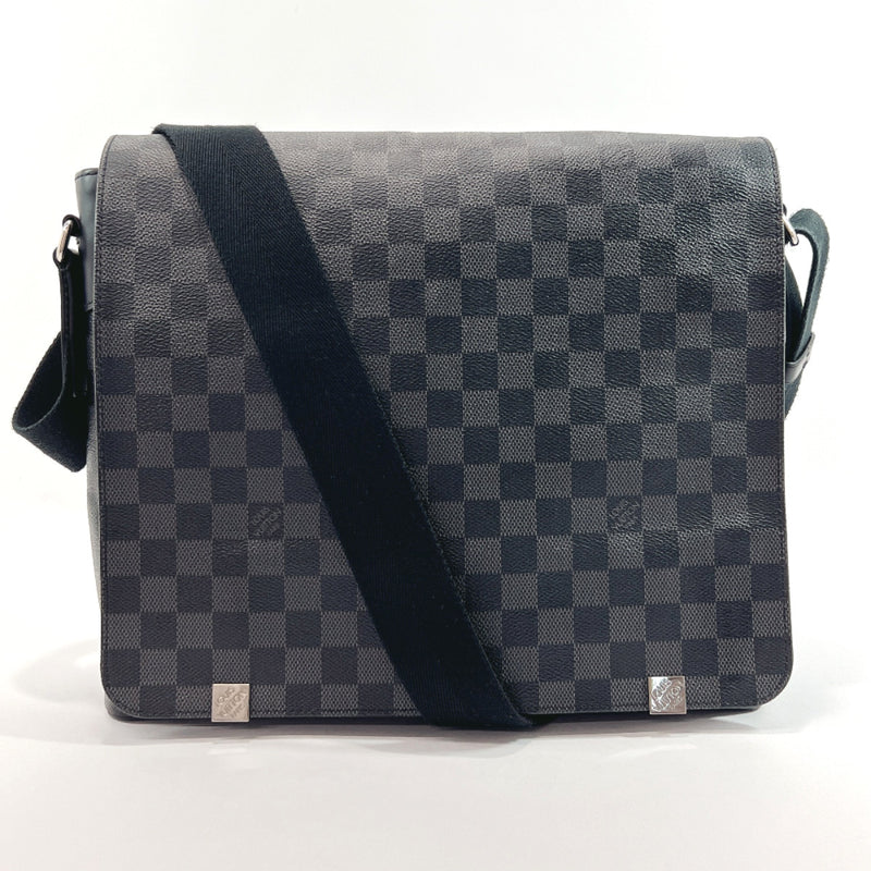 Woman with Gray and White Checkered Louis Vuitton Bag before